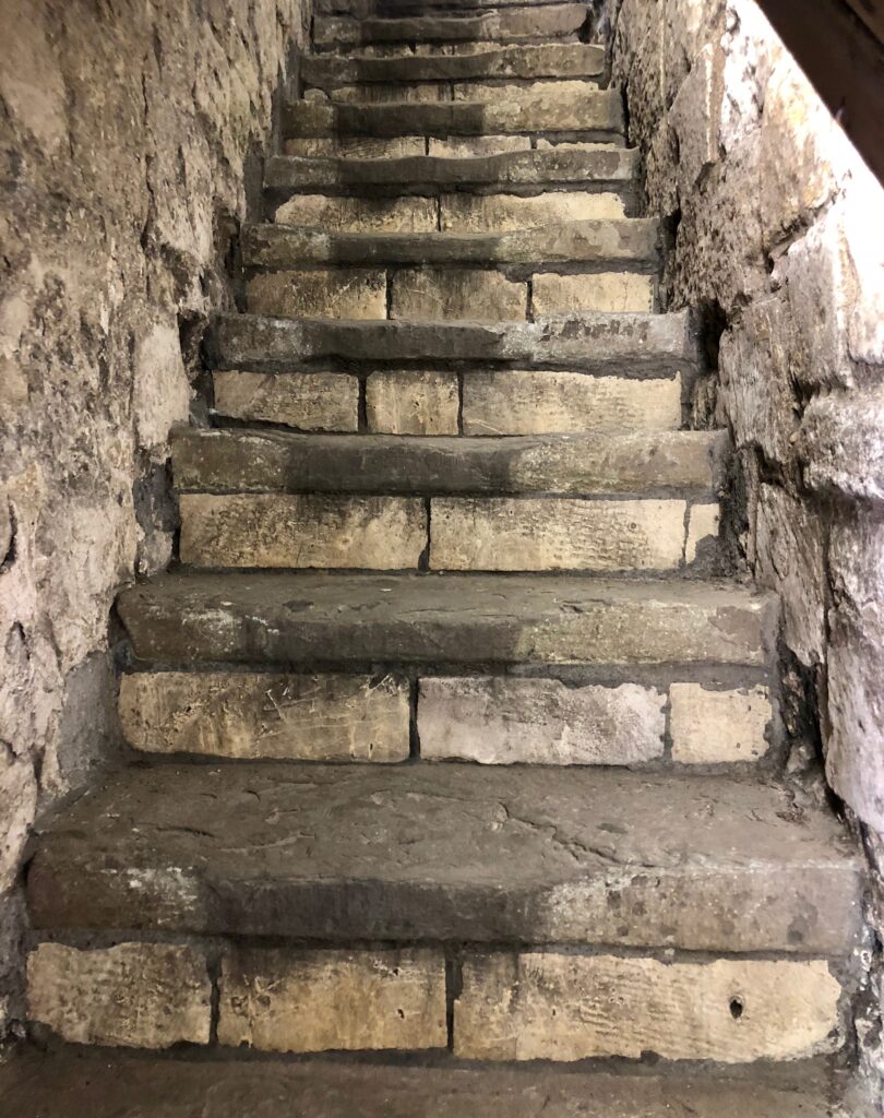 A stone staircase with steps leading up to it.